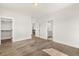 Bedroom with hardwood floors, walk-in closet, and bathroom access at 1005 Coleman Place Dr, Roswell, GA 30075