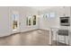 Kitchen dining area with hardwood floors and access to backyard at 1005 Coleman Place Dr, Roswell, GA 30075