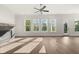 Sunlit living room featuring hardwood floors and a fireplace at 1005 Coleman Place Dr, Roswell, GA 30075