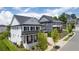 Aerial view of two-story homes with metal roofs, showcasing neighborhood appeal at 1010 Coleman Place Dr, Roswell, GA 30075