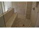 Walk-in shower with marble tile and herringbone floor at 1010 Coleman Place Dr, Roswell, GA 30075