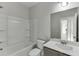 Clean bathroom with shower/tub combo, vanity, and mirror at 2870 S Waterworks Rd, Buford, GA 30518