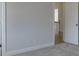 Bedroom with carpet, neutral walls, and access to hallway at 2870 S Waterworks Rd, Buford, GA 30518