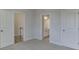 Bright bedroom with carpet and access to bathroom and hallway at 2870 S Waterworks Rd, Buford, GA 30518