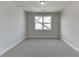 Simple bedroom with carpet and single window at 2870 S Waterworks Rd, Buford, GA 30518