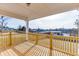 Covered deck with wooden railings, offering scenic views at 2870 S Waterworks Rd, Buford, GA 30518