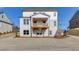 Two-story house with a large deck, and light-colored brick exterior at 2870 S Waterworks Rd, Buford, GA 30518