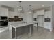 Modern kitchen with white cabinets, large island, and gray lower cabinets at 2870 S Waterworks Rd, Buford, GA 30518