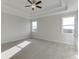 Bright main bedroom with a ceiling fan and neutral carpeting at 2870 S Waterworks Rd, Buford, GA 30518