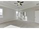 Main bedroom with coffered ceiling, neutral walls, and carpeting at 2870 S Waterworks Rd, Buford, GA 30518