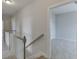 Upstairs hallway with staircase and access to bedrooms at 2870 S Waterworks Rd, Buford, GA 30518