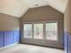 Bedroom with wood-look flooring and three windows at 320 Discovery Lake Dr, Fayetteville, GA 30215