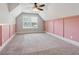 Bright bedroom with a vaulted ceiling, neutral wall paint and carpet flooring at 320 Discovery Lake Dr, Fayetteville, GA 30215