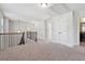 Spacious upstairs hallway with carpet, access to bedrooms and bath at 320 Discovery Lake Dr, Fayetteville, GA 30215