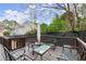 Backyard deck featuring outdoor seating and umbrella, perfect for relaxing at 992 Bridgegate Ne Dr, Marietta, GA 30068