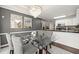 Dining room featuring a chandelier, glass table and white kitchen in the background at 992 Bridgegate Ne Dr, Marietta, GA 30068