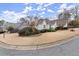 Well-manicured lawn surrounds the exterior of this charming single-Gathering home in a quiet neighborhood at 992 Bridgegate Ne Dr, Marietta, GA 30068