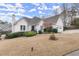 Charming home with a well-maintained front yard, manicured bushes and attached garage at 992 Bridgegate Ne Dr, Marietta, GA 30068