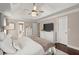 Spacious main bedroom with a tray ceiling, ceiling fan and ensuite bathroom access at 992 Bridgegate Ne Dr, Marietta, GA 30068