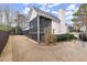 Inviting screened-in porch offers a relaxing outdoor space, perfect for enjoying the serene backyard at 992 Bridgegate Ne Dr, Marietta, GA 30068