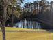 Reflecting pond featuring a central fountain, nestled in a wooded area at 417 Crimson Maple Way, Smyrna, GA 30082