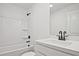 Clean bathroom featuring a shower over the tub and dark fixtures at 699 Sunstone Ln, Lawrenceville, GA 30043