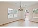 Cozy dining area with hardwood floors, modern chandelier, and access to outdoor space at 699 Sunstone Ln, Lawrenceville, GA 30043