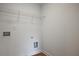 Laundry room with hookups and shelves at 699 Sunstone Ln, Lawrenceville, GA 30043