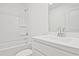 Clean bathroom with a tub and shower, a single sink vanity, and ample counter space at 695 Sunstone Ln, Lawrenceville, GA 30043