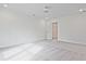 Sunlit bedroom featuring neutral carpet flooring and bright white walls and molding at 695 Sunstone Ln, Lawrenceville, GA 30043