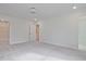Spacious bedroom with neutral carpet, bright white walls, closet and bathroom access at 695 Sunstone Ln, Lawrenceville, GA 30043