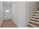 View of the entrance featuring wood-look floors and a staircase at 695 Sunstone Ln, Lawrenceville, GA 30043