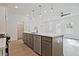 Modern kitchen showcasing a center island with sink, dishwasher, and sleek appliances at 695 Sunstone Ln, Lawrenceville, GA 30043