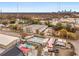 Aerial view of a mixed-use area featuring commercial spaces, outdoor recreational areas, and the city skyline in the distance at 130 Arizona Ne Ave # 104, Atlanta, GA 30307