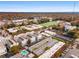 Aerial view of a building complex featuring a swimming pool, parking, and landscaping set within a vibrant neighborhood at 130 Arizona Ne Ave # 104, Atlanta, GA 30307