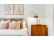 Cozy bedroom with stylish nightstand, decorative pillows, and modern wall sconce at 130 Arizona Ne Ave # 104, Atlanta, GA 30307