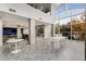 Expansive living room with floor to ceiling windows, concrete pillars, and an open-concept design at 130 Arizona Ne Ave # 104, Atlanta, GA 30307