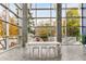 Bright lobby with floor to ceiling windows, concrete columns, minimalist lighting, and modern seating at 130 Arizona Ne Ave # 104, Atlanta, GA 30307