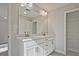 Bathroom with double vanity, a large mirror, and linen storage at 693 Sunstone Ln, Lawrenceville, GA 30043