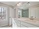 Bathroom boasting a double sink vanity, a large window, and linen storage at 693 Sunstone Ln, Lawrenceville, GA 30043