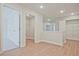 Hallway with open closet and a laundry room, featuring modern finishes at 693 Sunstone Ln, Lawrenceville, GA 30043