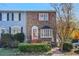 Brick front townhouse with a charming bay window and well-manicured landscaping at 260 Manning Sw Rd # 62, Marietta, GA 30064