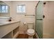 Modern bathroom featuring white vanity with dual sinks and glass shower door at 4103 Brenda Dr, Decatur, GA 30035