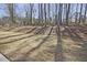 A spacious backyard with fresh sod and mature trees at 691 Sunstone Ln, Lawrenceville, GA 30043