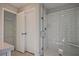 Bathroom featuring a glass-enclosed shower with subway tile and a built-in seat at 691 Sunstone Ln, Lawrenceville, GA 30043