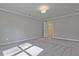 Light-filled bedroom with neutral carpet and a walk-in closet visible through an open door at 691 Sunstone Ln, Lawrenceville, GA 30043