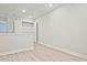 Hallway with vinyl wood floors, neutral paint, and a closet with white shelving at 691 Sunstone Ln, Lawrenceville, GA 30043