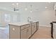 Modern kitchen island with a stainless steel sink, modern faucet, and dishwasher at 691 Sunstone Ln, Lawrenceville, GA 30043