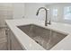 Kitchen island showcasing a deep stainless steel sink with modern pull-down faucet at 691 Sunstone Ln, Lawrenceville, GA 30043