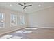 Spacious living room featuring hardwood floors, recessed lighting, and large windows at 691 Sunstone Ln, Lawrenceville, GA 30043